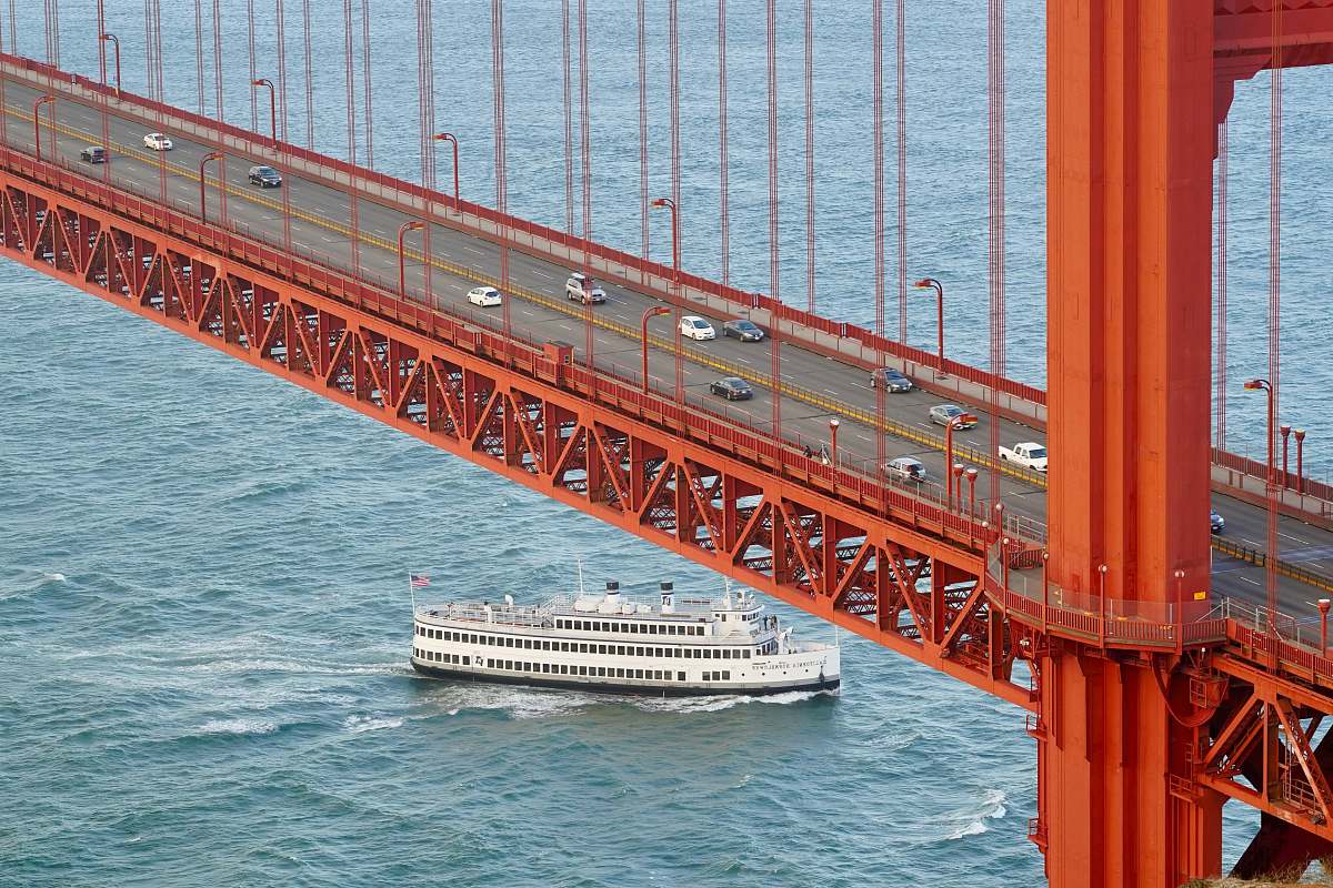 boat white cruise ship under concrete bridge ferry